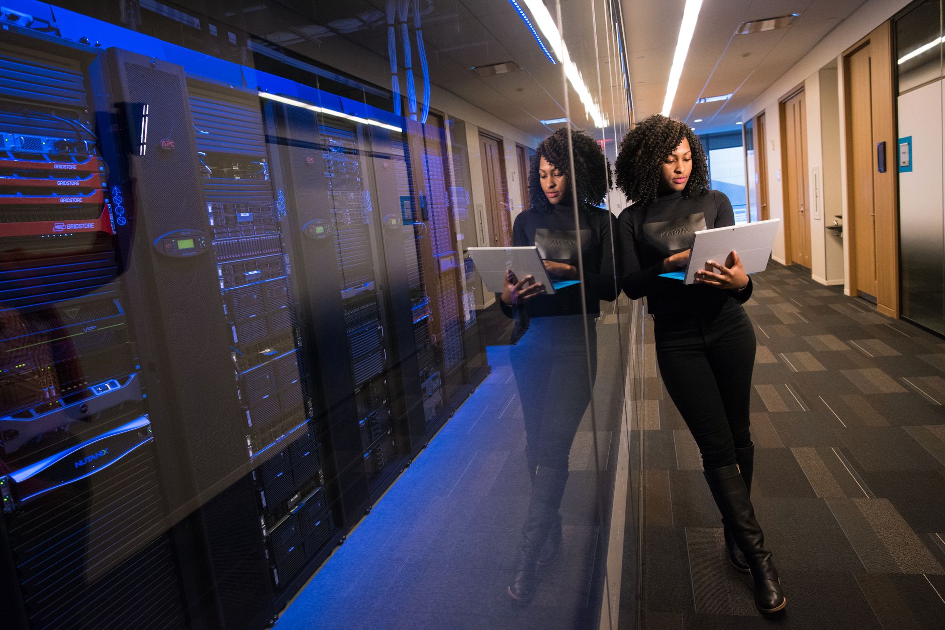 Dark server rack infrastructure powering the GOV.UK Notify API platform