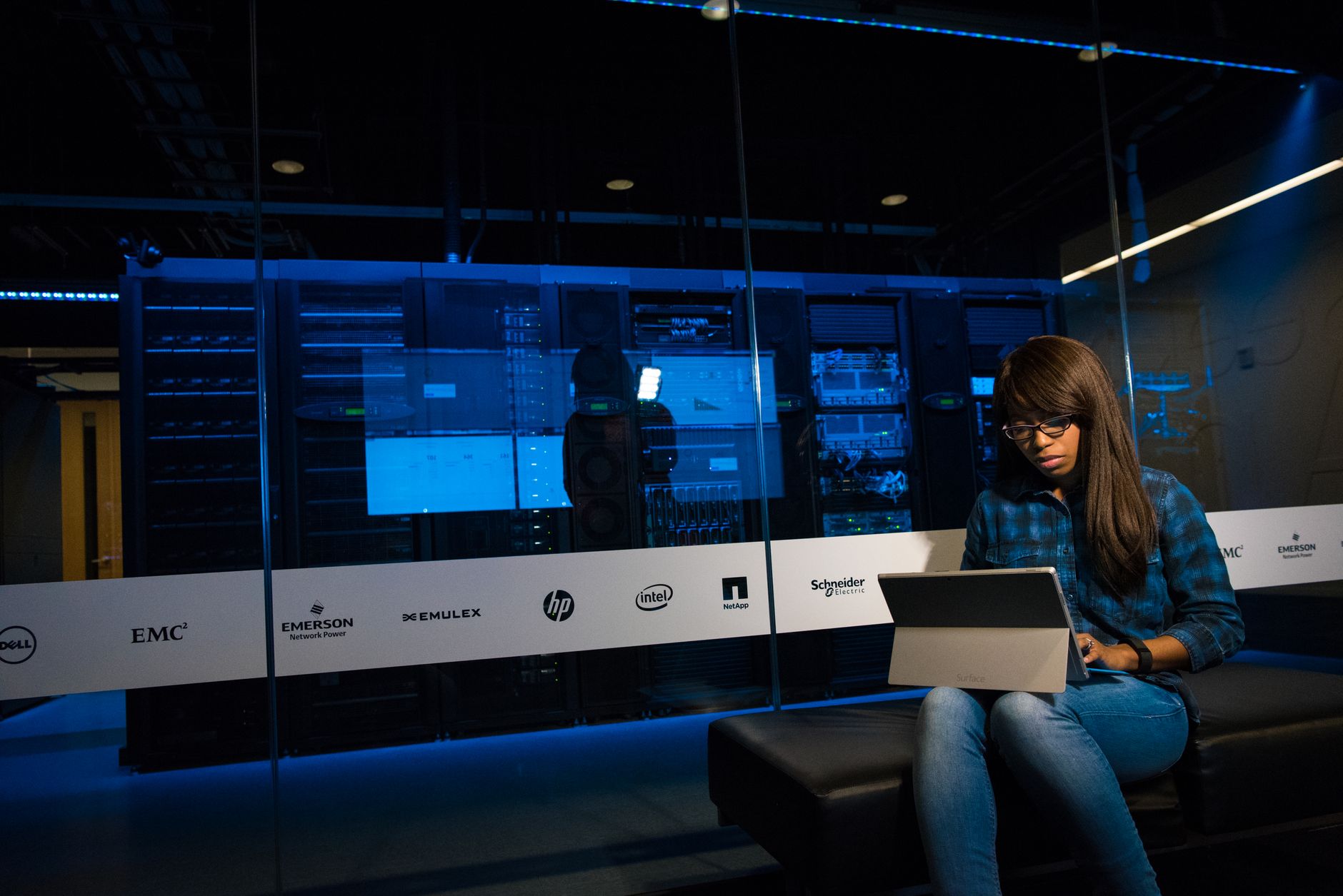 Dark server room representing UK fraud prevention databases running in real time