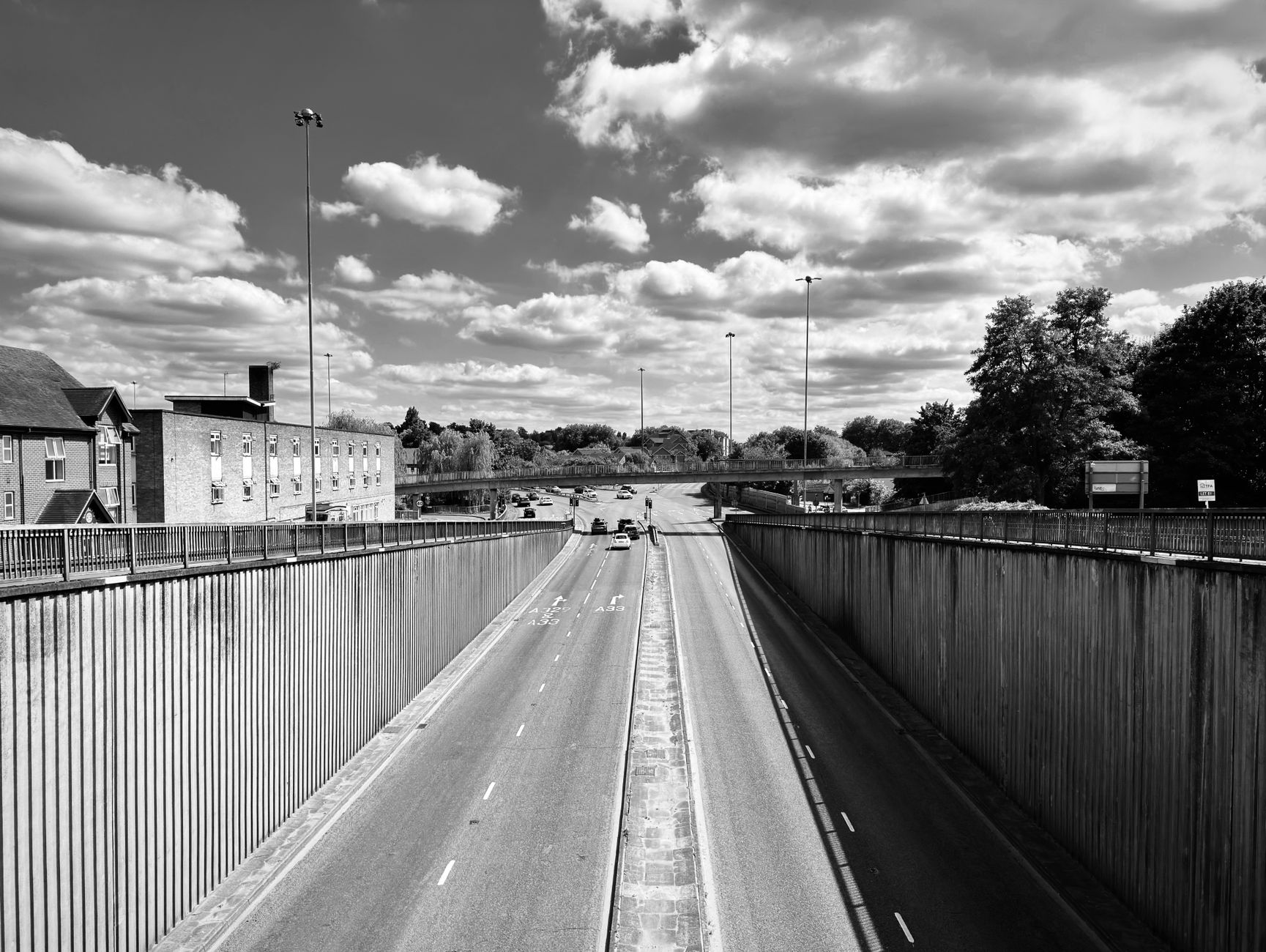 UK national ANPR network camera on motorway gantry at dusk capturing plate reads